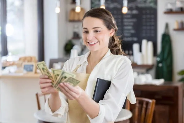 Small business owner reviewing finances and cash flow warning signs