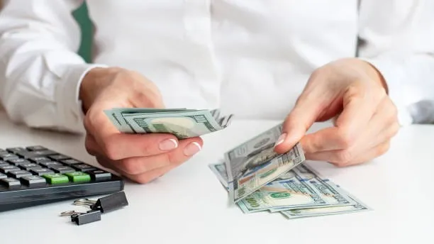 Startup founder reviewing invoices and funding options